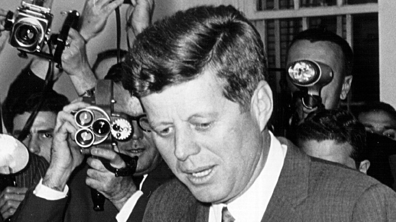 John F. Kennedy surrounded by press