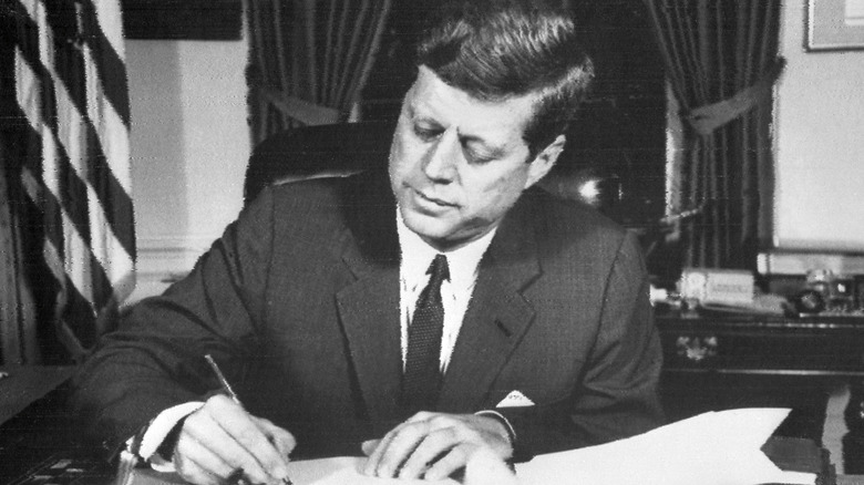 JFK writing on paper