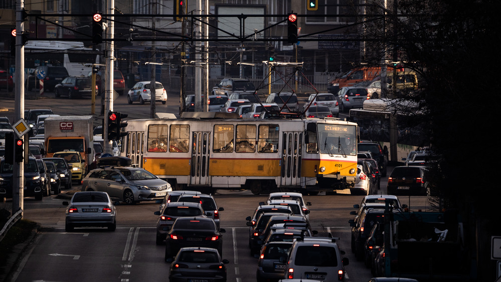 A street in Bulgaria with a bus and cars