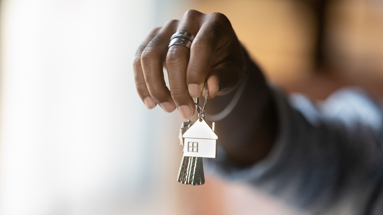 Black person holding house keys