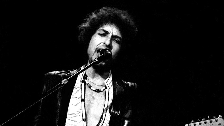 Bob Dylan singing microphone black white