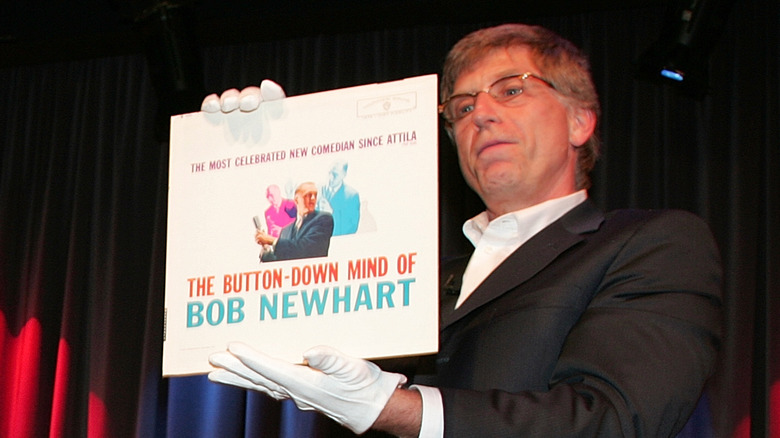 Man holds Button-Down Mind of Bob Newhart LP