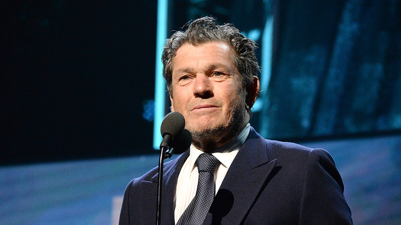 Jann Wenner speaking at microphone