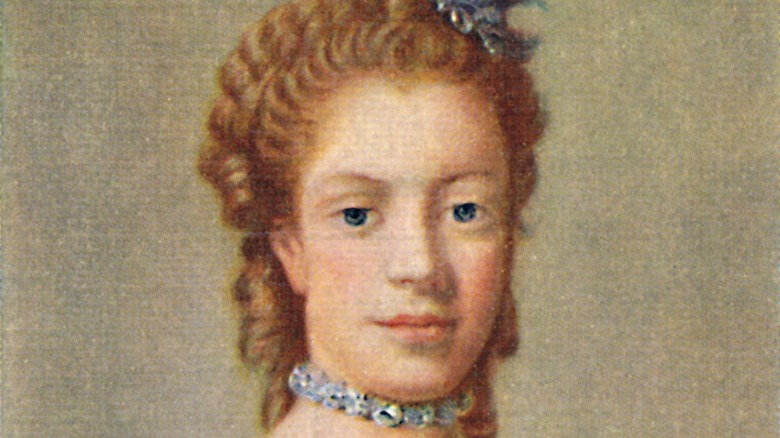 Queen Charlotte smiles in a portrait