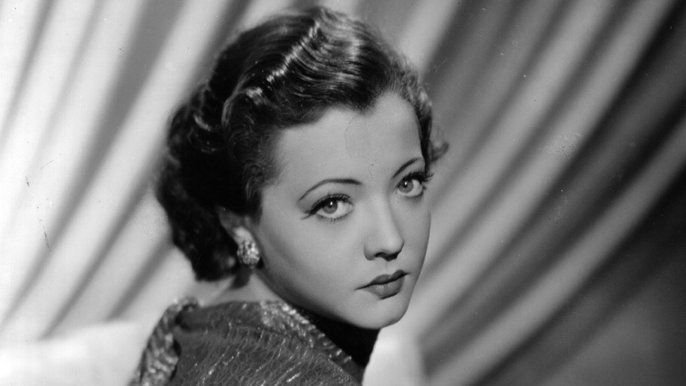 Sylvia Sidney looking over shoulder