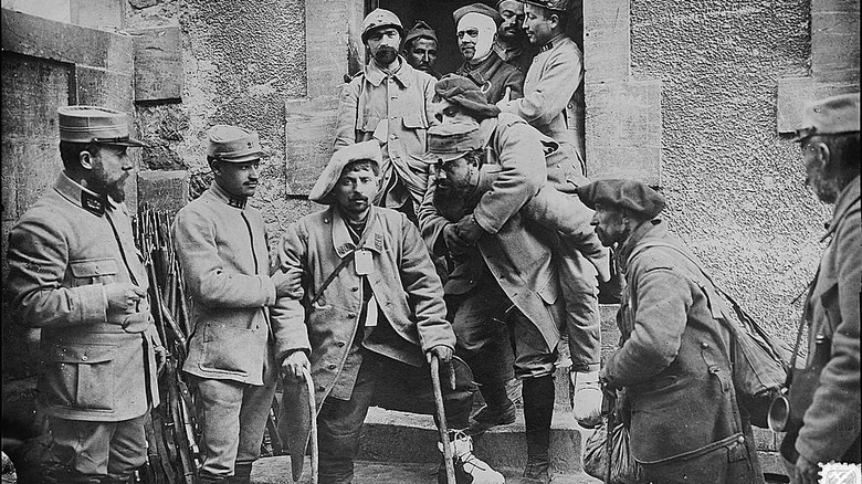 Wounded soldiers outside building