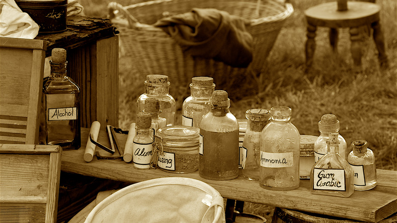 Old medication bottles on table