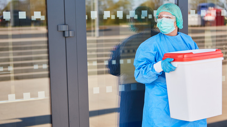 Doctor with donor organ container