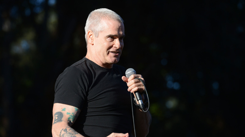 Henry Rollins on stage with microphone