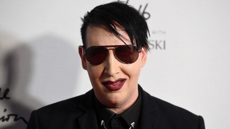 Marilyn Manson smirking