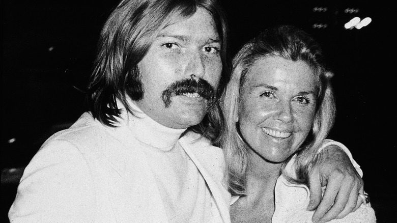 Doris Day and Terry Melcher smiling hugging