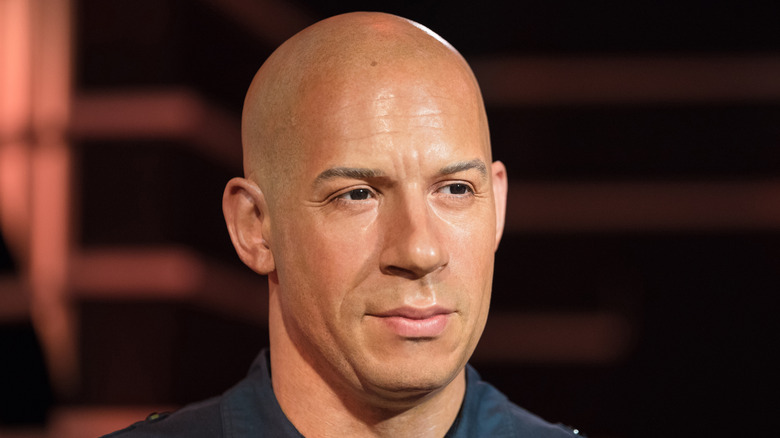 Vin Diesel pensive blue shirt