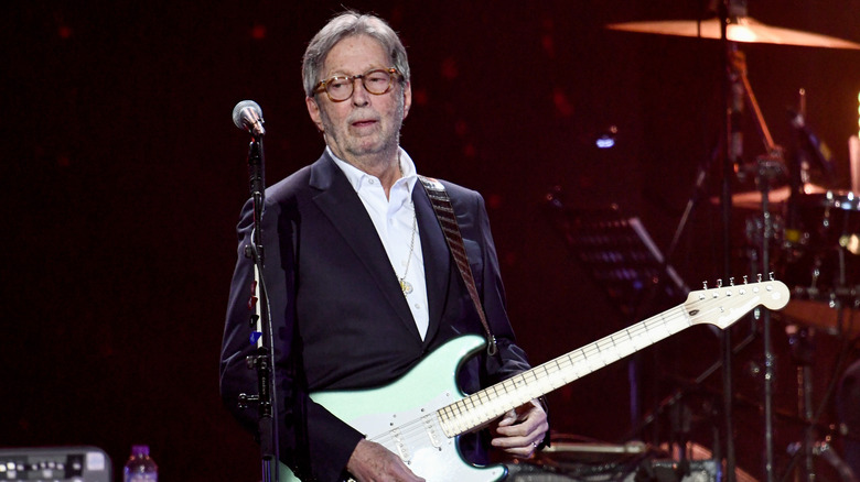 Eric Clapton suit glasses guitar onstage