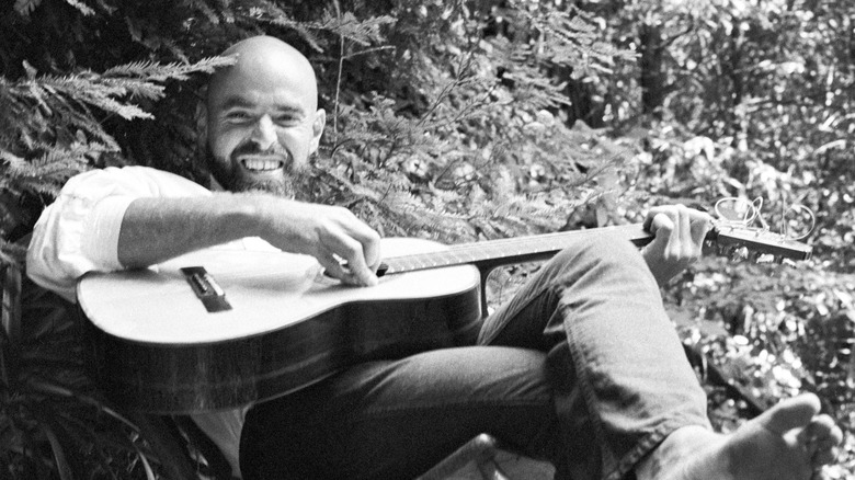 Shel Silverstein playing guitar