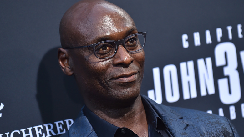 Lance Reddick smiling glasses