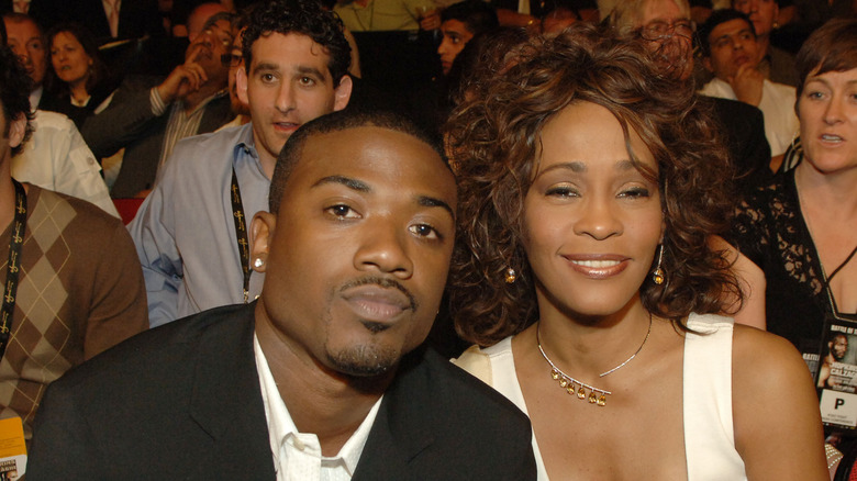 Whitney Houston with Ray-J posing camera