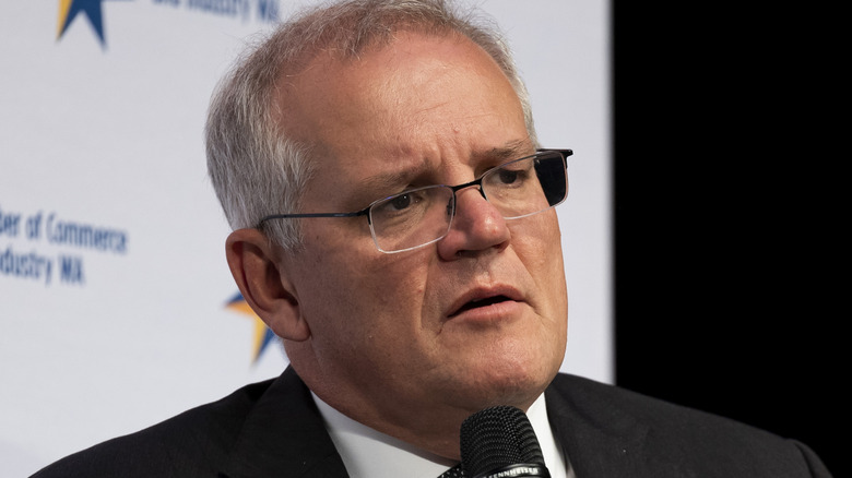 Scott Morrison holding a microphone