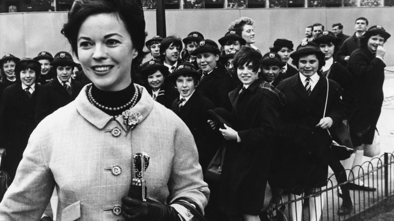 Shirley Temple Black with a group of schoolkids