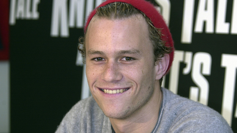 Heath Ledger in red hat smiling 