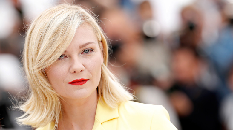 Kirsten Dunst yellow suit red lipstick