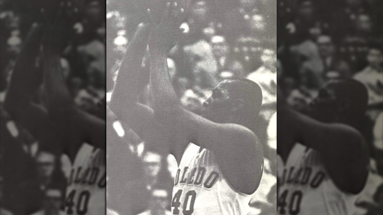 John Brisker shooting a basket