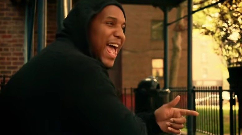 Ra Diggs rapping black hoodie outdoors