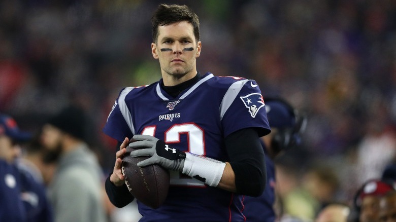 Tom Brady holding a football