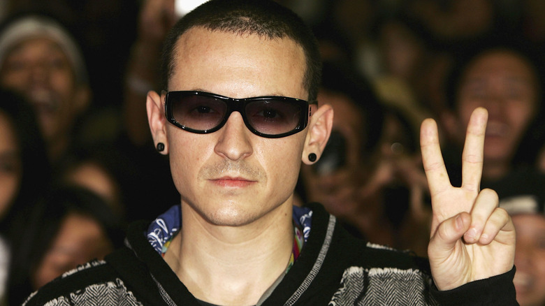 Chester Bennington giving peace sign in sunglasses