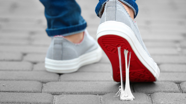 Chewing gum on sole of shoe in street