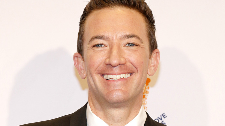 David Faustino suit smiling