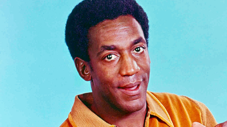 Bill Cosby mouth open yellow shirt