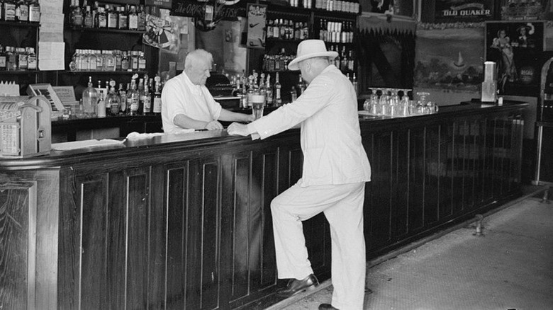 Man drinking at saloon 1938