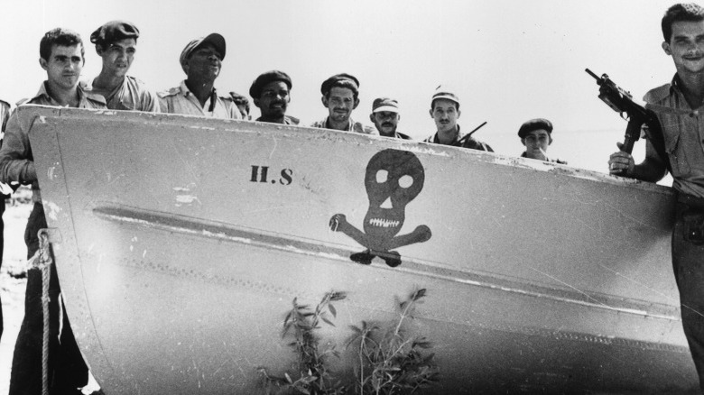 Cuban soldiers with boat