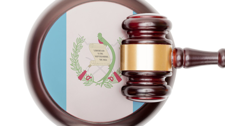  legal system concept with Guatemala flag on sound block