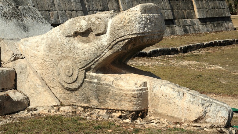 Stone serpent head at Chichen Itza