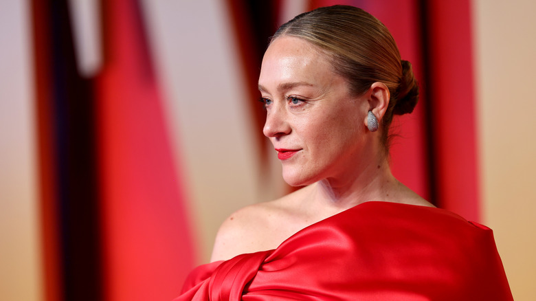 Chloë Sevigny poses red dress