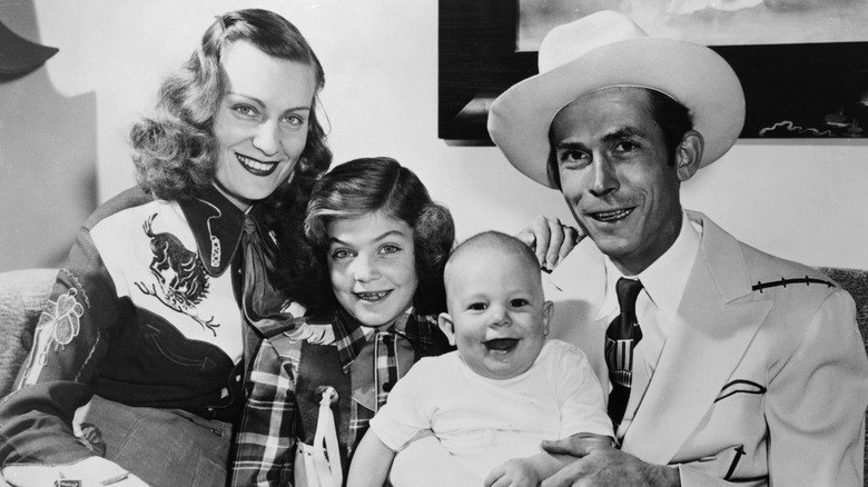 Hank Williams posing with his wife and two children