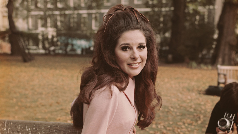 Bobbie Gentry doing a photoshoot in a park