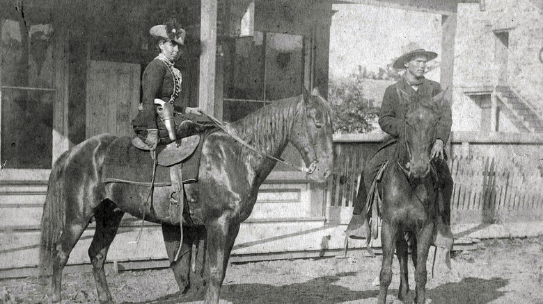 Belle Starr and a man riding horses