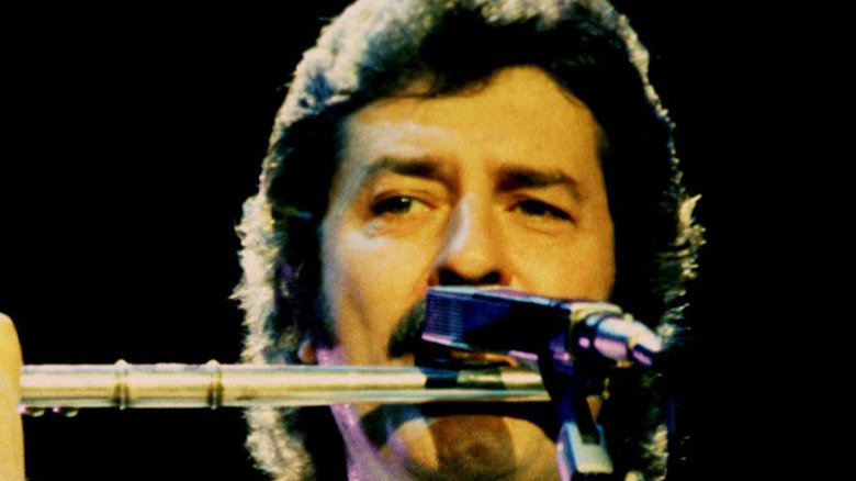 Ray Thomas playing flute