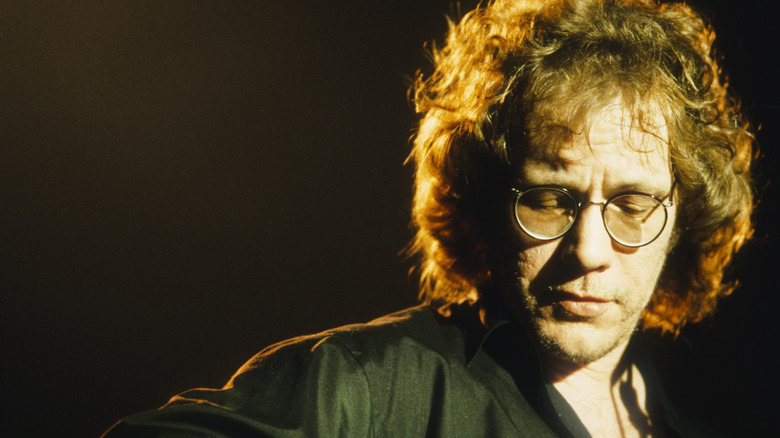 Warren Zevon performing onstage glasses