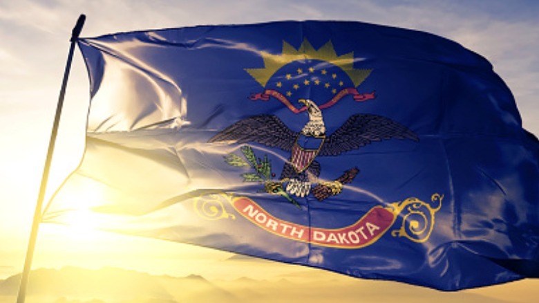 State flag of North Dakota flying sunrise