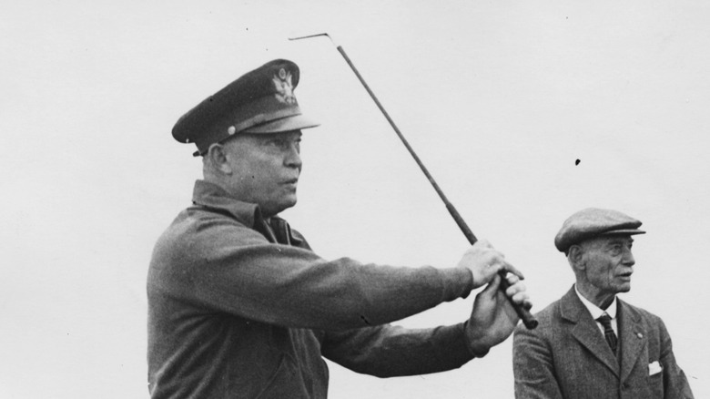 President Dwight D. Eisenhower uniform swinging golf club