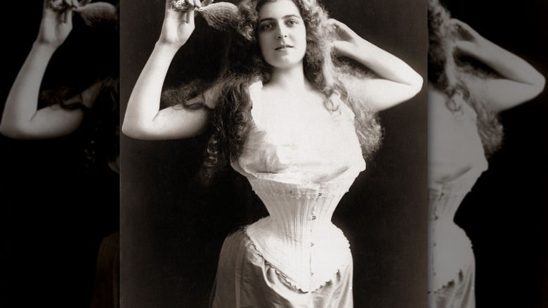 Photograph of an American woman wearing a corset, 1899, toned silver print