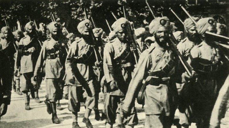 Indian soldiers marching with rifles France 1914