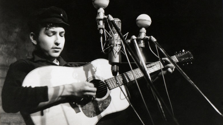 Bob Dylan performing on stage