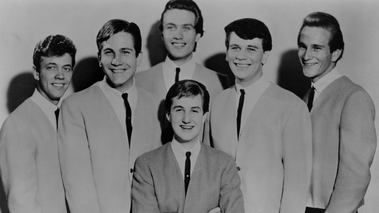 Jack Ely and The Kingsmen posing for a photo