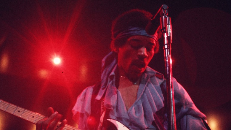 Jimi Hendrix performing on stage