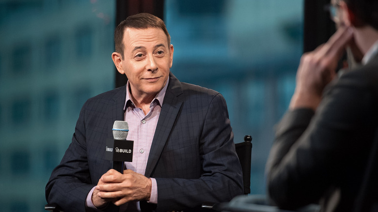 paul reubens holding microphone