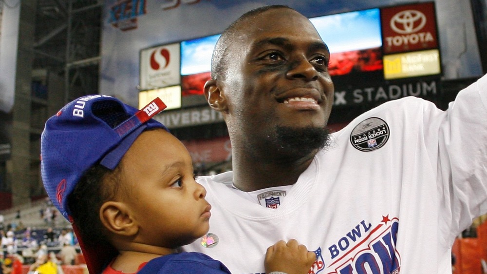 Plaxico Burress holding son